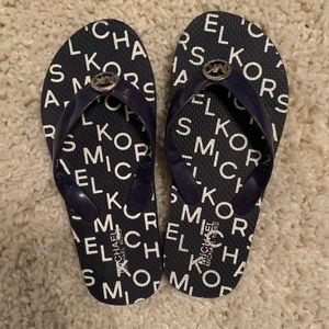 Michael Kors flip flops.  New